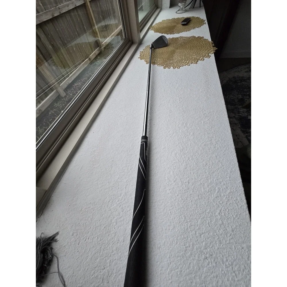 Wilson Ultra BLK iron, recognizable by the orange cavity.pitching Wedge 35.25